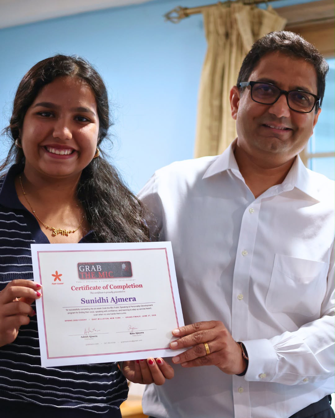 Ashish presenting a certificate to a graduate