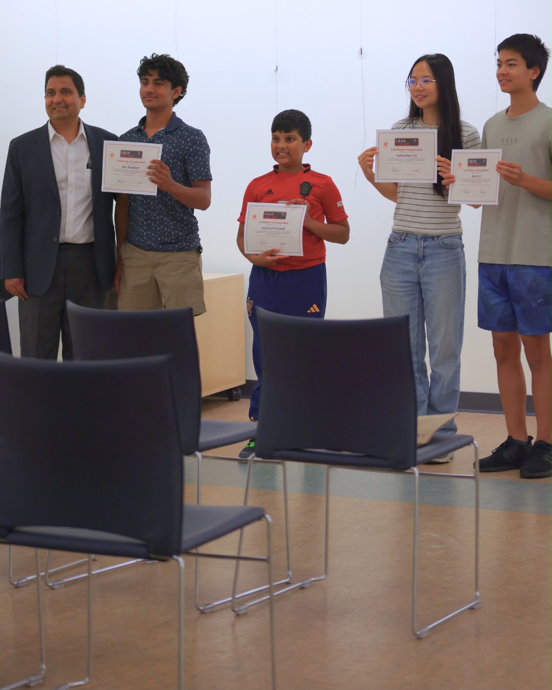 Grab the Mic Spring 2026 graduates with their certificates